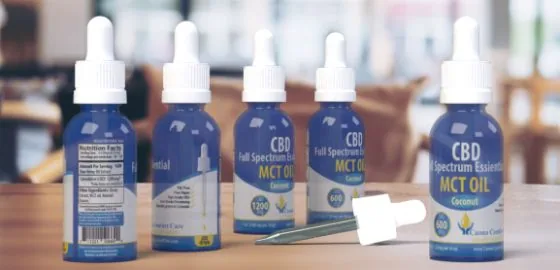 3D label mockups for Canna Comfort Care CBD MCT oil bottles, designed by Jeremy Benisek.